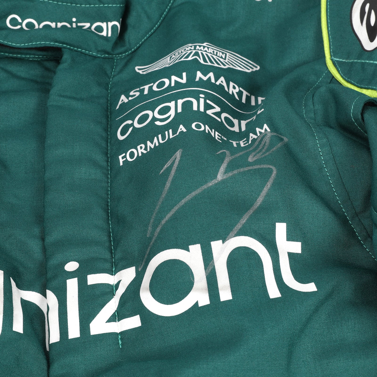 LOT 549 - Aston Martin Aramco Formula One® Team x Movember – Lance Stroll Suit & Wheel Rim