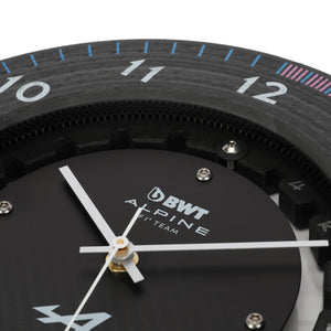 Close-up of Alpine Formula 1 brake disc clock showing drilled carbon disc