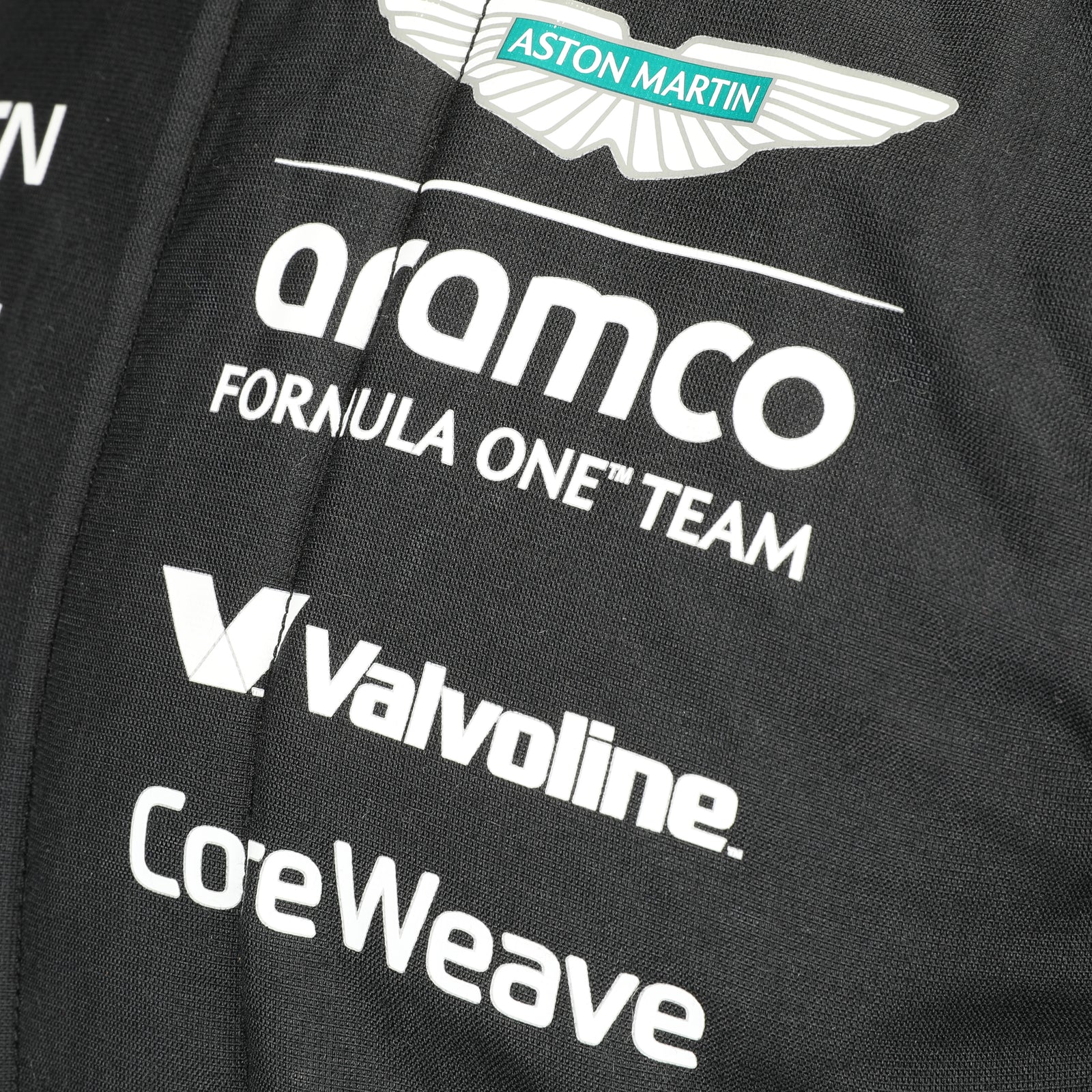 Race-used Fernando Alonso Aston Martin Formula One Team 2025 suit from the Austin Grand Prix display