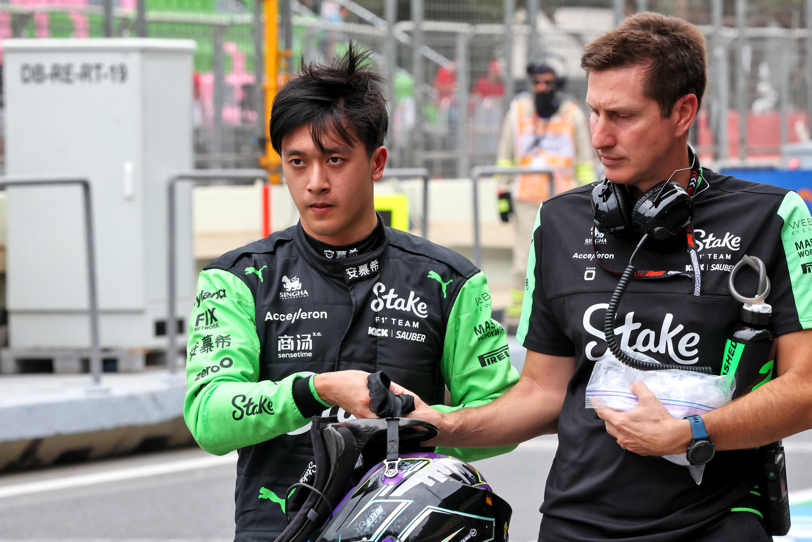 LOT 030 - Zhou Guanyu 2024 Stake F1® Team KICK Sauber Grand Prix Used Racewear Bundle